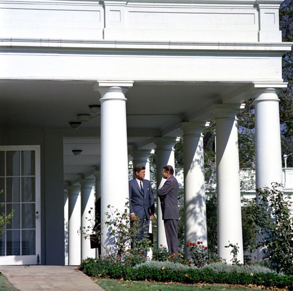 U.S. President John F. Kennedy speaking with U.S. Secretary of Defense Robert S. McNamara (right)