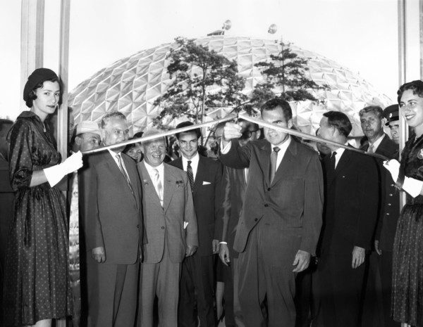 U.S. Vice President Richard M. Nixon cutting ceremonial ribbon at the opening of the American