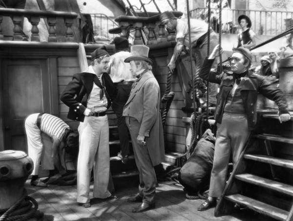 Robert Donat (left), Walter Walker (top hat), on-set of the film, "The Count Of Monte Cristo",