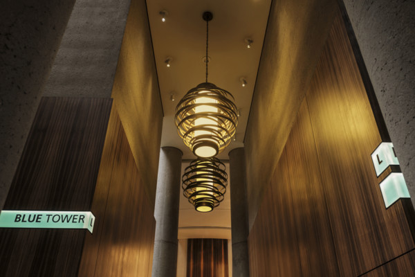 Two large spiral pendant lights in hotel lobby