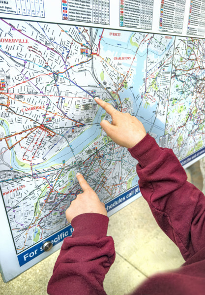 Fingers pointing at outdoor city map, Boston