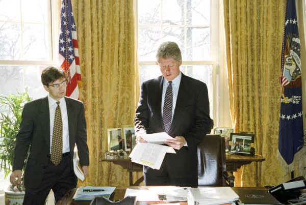 U.S. President Bill Clinton meeting with White House Communications Director George Stephanopoulos
