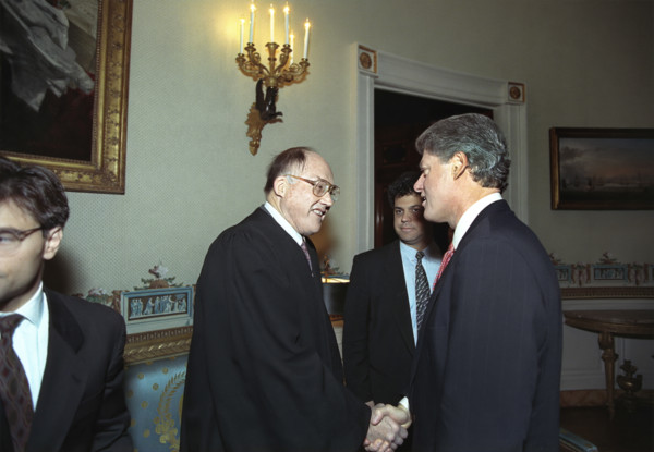U.S. President Bill Clinton shaking hands with Chief Justice of the U.S. William Rehnquist in the