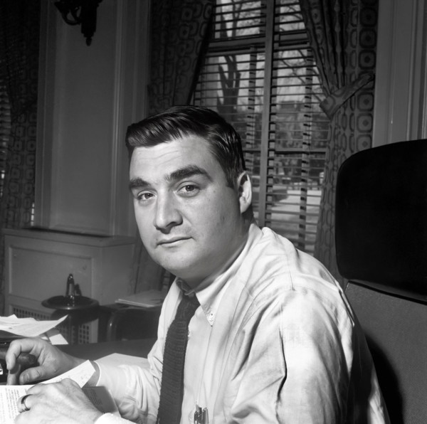 U.S. Press Secretary Pierre Salinger sitting in his office in the White House, Washington, D.C.,