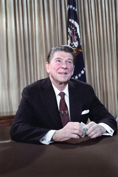 U.S. President Ronald Reagan's address to the nation on the economy (holding dollar) from Oval