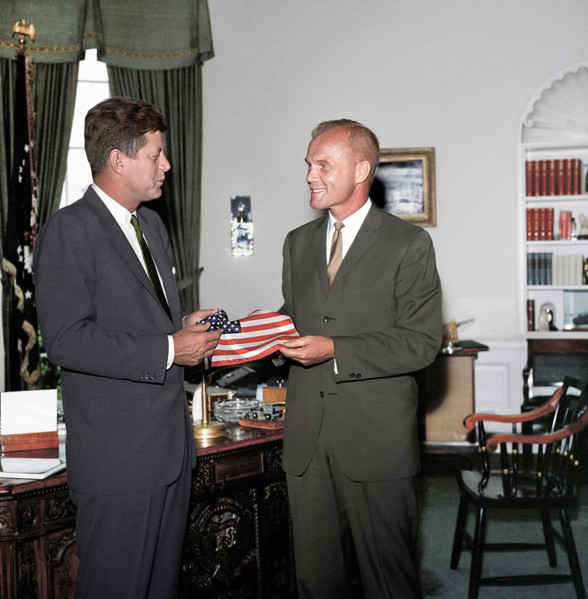 U.S. President John F. Kennedy receiving gift of an American flag from astronaut Lieutenant Colonel