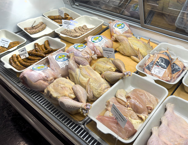 Raw chicken and sausages display case, Dickson's Farmstand Meats, Chelsea Market, Chelsea,