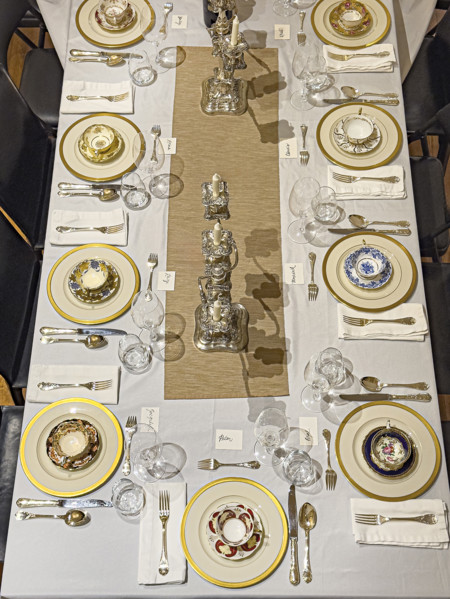 High angle view of dining room table set for formal dinner