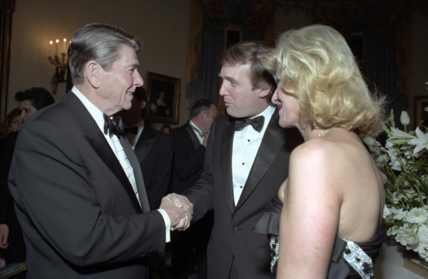 U.S. President Ronald Reagan shaking hands with Donald Trump and Ivana Trump during state visit of