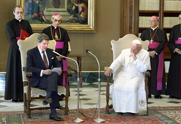 U.S. President Ronald Reagan visiting with Pope John Paul II in library of The Vatican Pontifical