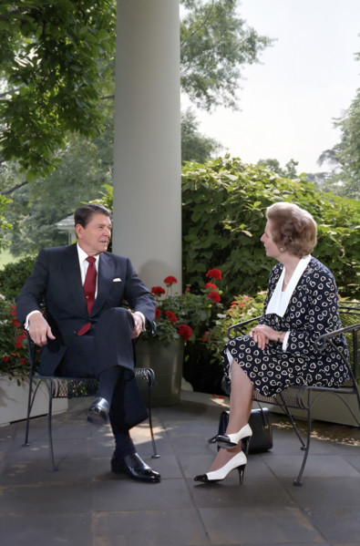 U.S. President Ronald Reagan and British Prime Minister Thatcher talk on patio outside White House