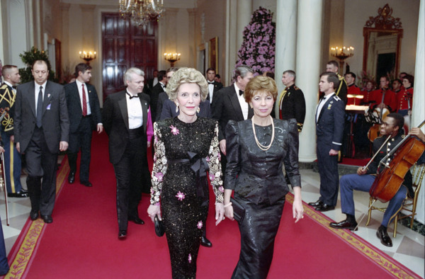 U.S. First Lady Nancy Reagan walking with First Lady of the Soviet Union Raisa Gorbachev in White
