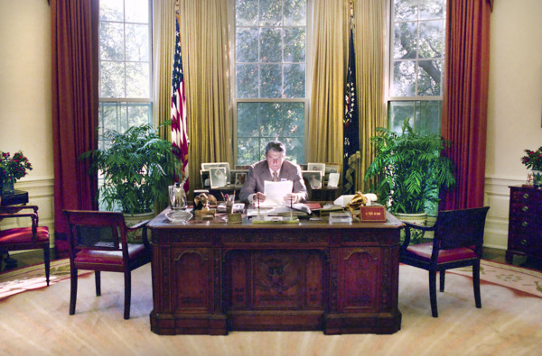 U.S. President Ronald Reagan working in White House Oval Office, Washington, D.C., USA, President