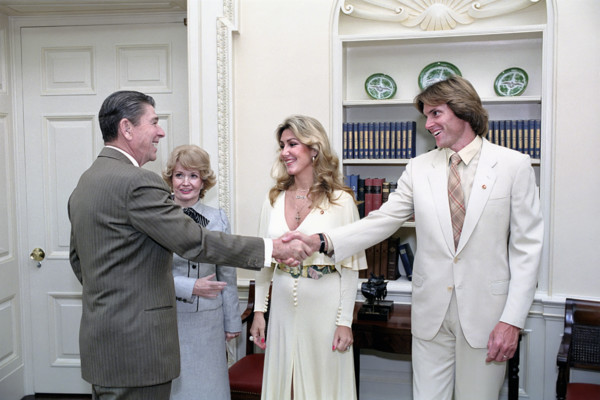 U.S. President Ronald Reagan shaking hands with Bruce Jenner, with his wife Linda Jenner and