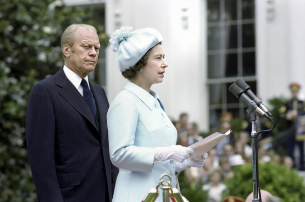 U.S. President Gerald R. Ford listening to Queen Elizabeth II delivering remarks at a State arrival