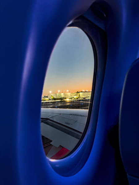 View of airport through window of Jet Blue Airlines commercial airplane, Fort Lauderdale-Hollywood