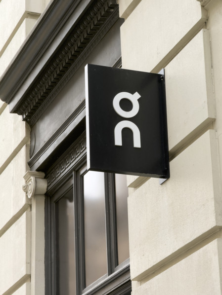 On running shoes and apparel retail store, company logo on building exterior, 162 Fifth Avenue,