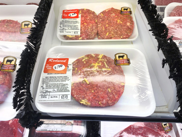 Reduced priced beef hamburger patties in grocery store