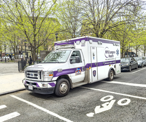 NYU Langone Health EMS ambulance parked on urban street, Chelsea, Manhattan, New York City, New