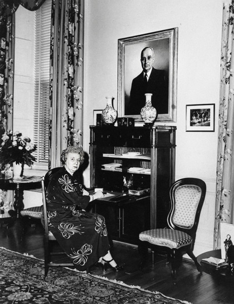U.S. First Lady Bess Truman seated at her secretary-type desk in Truman living quarters at the