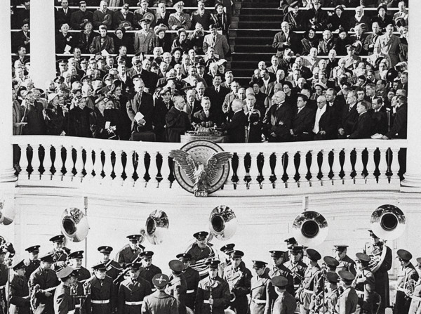U.S. President Harry S. Truman (center foreground, right) taking oath of office and is sworn in as