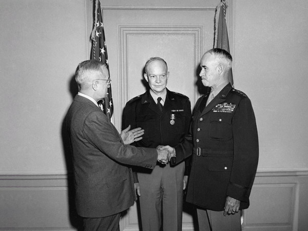 U.S. President Harry S. Truman (left) shaking hands with U.S. General Omar Bradley (right), who had