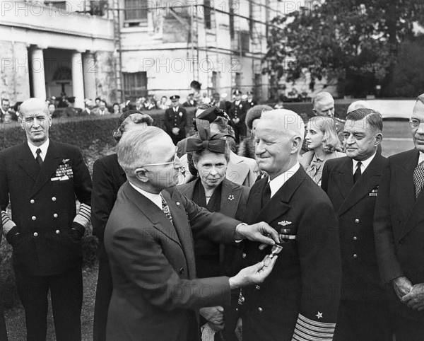 U.S. President Harry S. Truman (left foreground) giving U.S. Admiral Chester Nimitz (right