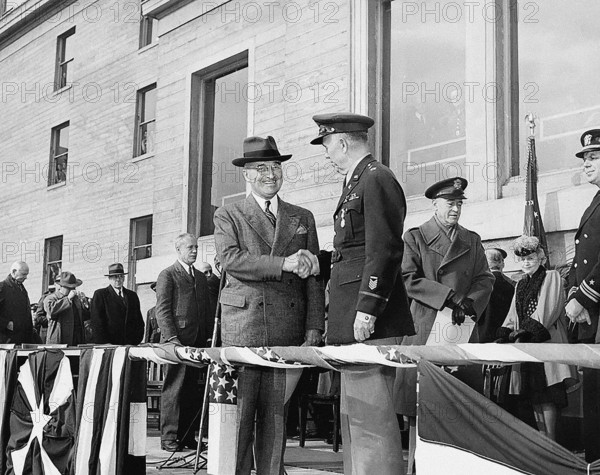 U.S. President Harry S. Truman (right center) shaking hands with retiring U.S. Army Chief of Staff