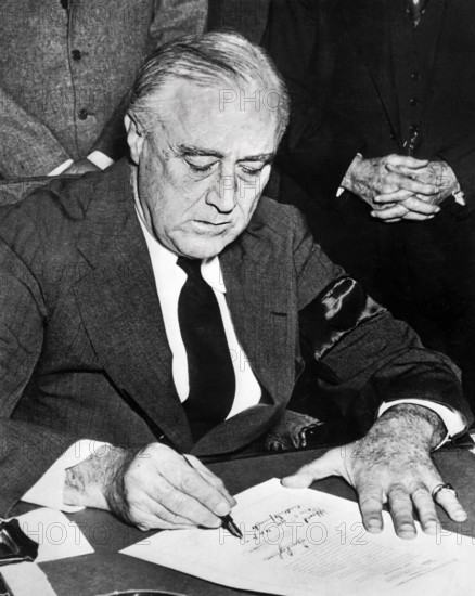 U.S. President Franklin D. Roosevelt signing declaration of war against Japan, Washington, D.C.,