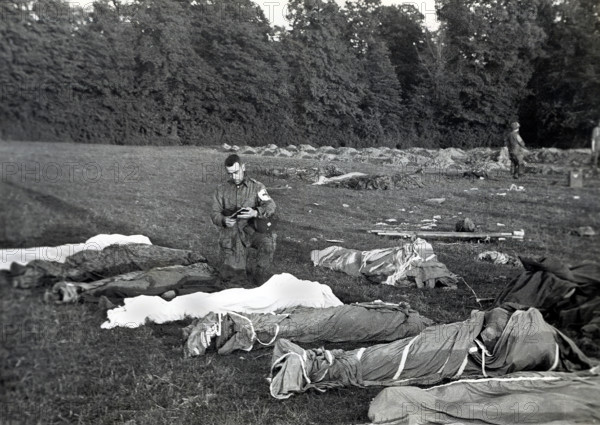 U.S. Army Chaplain Francis L. Sampson of Sioux Falls, S.D., giving absolution to American