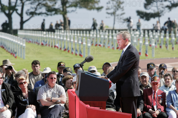 U.S. President George W. Bush addressing World War II veterans and families during 60th anniversary
