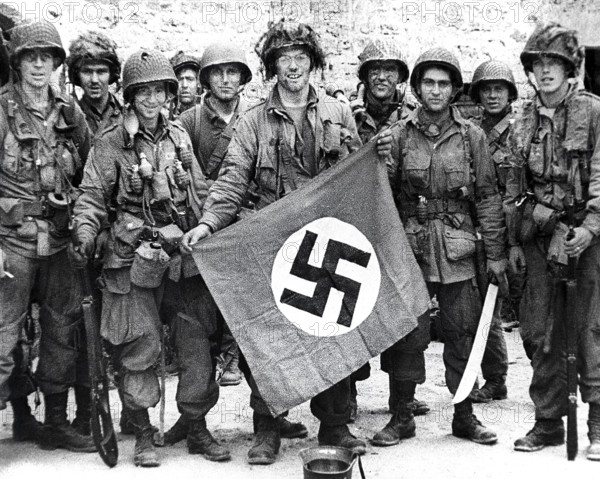 American paratroopers, among the first to make successful landings on European continent, holding