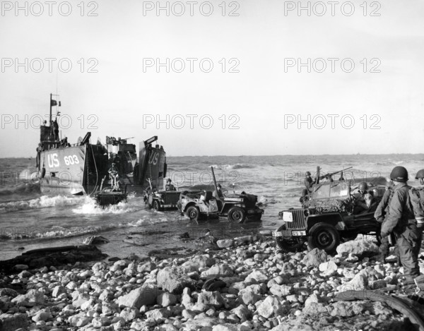 U.S. Army Jeeps of 5th Engineer Special Brigade debark from LST at Fox Green, Omaha Beach,