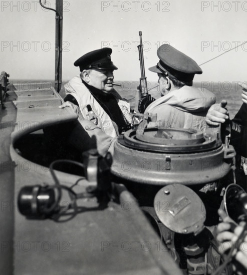 Prime Minister Winston Churchill of Great Britain, left, chatting with British General Sir Alan