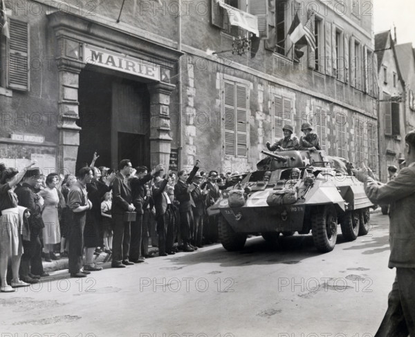 U.S. Major General Lindsay McDonald Silvester, 7th Armored Division, receiving cheers from French