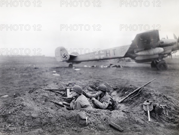 U.S. G.I.'s watching for enemy activity from their outpost at German airfield captured by U.S.