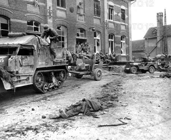 Members of Company G, 2nd Battalion, 16th regiment, 1st Division, U.S. First Army with military