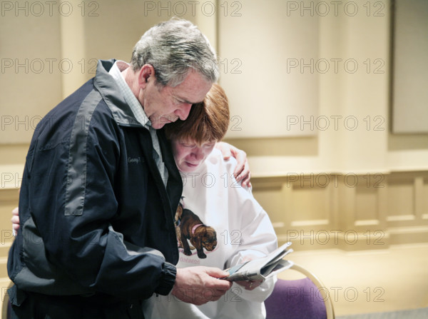 U.S. President George W. Bush meeting with tornado victim, Hillcrest Baptist Church, Enterprise,