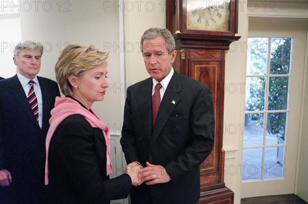 U.S. President George W. Bush shaking hands with U.S. Senator from New York Hillary Rodham Clinton