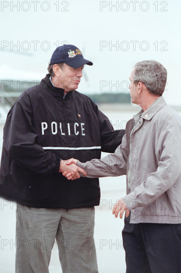 New York Governor George Pataki greeting U.S. President George W. Bush upon his arrival at McGuire