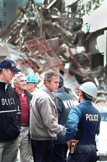 U.S. President George W. Bush touring World Trade Center disaster site with New York Governor
