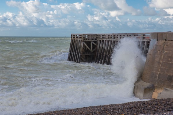 Wave flooding the dyke