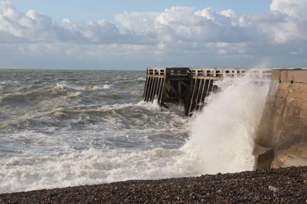 Wave flooding the dyke