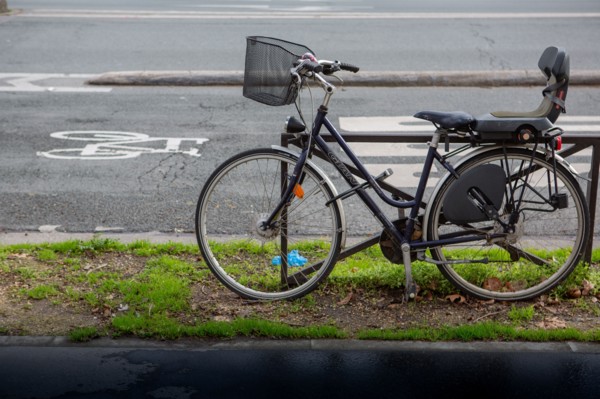 Paris, parked bicycle near a cycle path