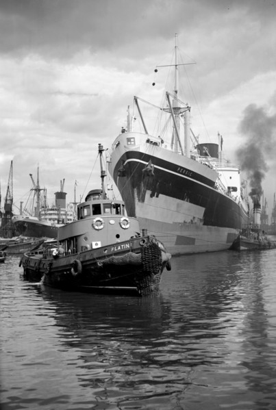 Persic' being guided up Woolwich Reach, London, c1945-c1965