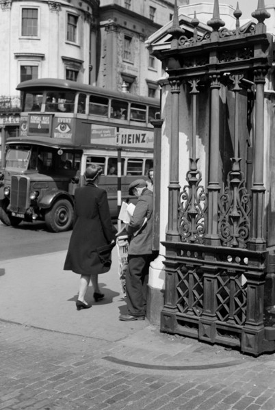 A newspaper seller at Charing Cross Station, London, c1945-c1955