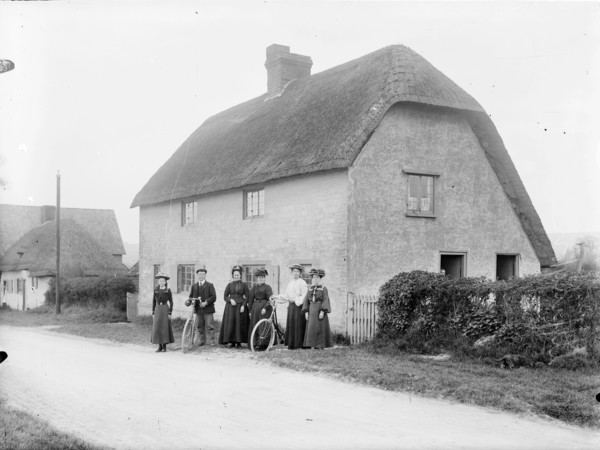 People standing outside a thatched cottage, Uffington, Oxfordshire, 1916