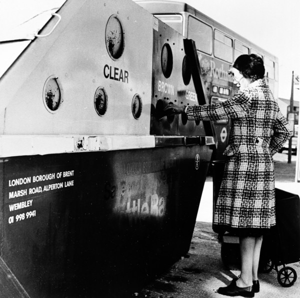 Woman using a bottle bank in Brent, London, c1950s. Artist: Henry Grant
