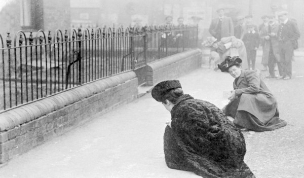Emma Sproson (left) and a friend chalking the pavement, 1907. Artist: Unknown