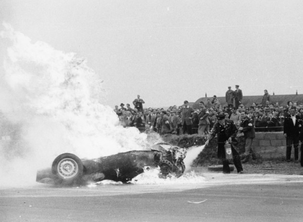 Tony Brooks' car on fire at the British Grand Prix, Silverstone, Northamptonshire,1956. Artist: Unknown